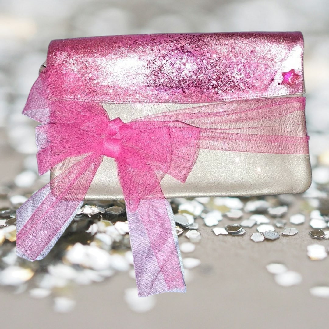 Taupe Silver colored clutch with pink sparkle and bow